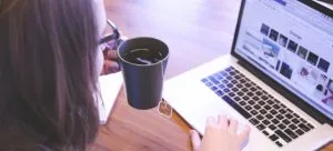 A person using a laptop to make your HK move easier