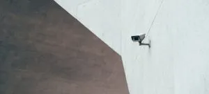 A person thinking about the traits of a reputable storage facility while looking at the security camera