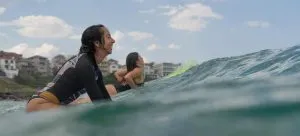 two women surfing