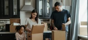 a family unpacking boxes together