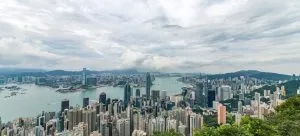 City Buildings and Green Trees Near Ocean - Wallet-Friendly HK Relocation.