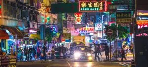 Busy street and people embracing Hong Kong's traditions and customs after moving