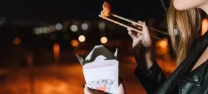 Girl eating asian food
