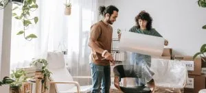 Couple packing furniture