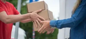 Girl helping movers to load a moving truck