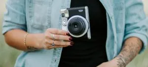 A woman taking photos before moving