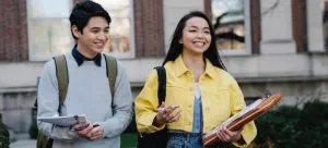 a couple walking after moving to a big city for the first time