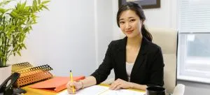 Girl reading moving contract before handling disputes with movers