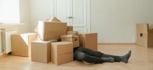 person among boxes