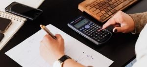 person using calculator