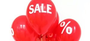 red balloons with a word sale written on one of them as a sign to negotiate storage costs in Hong Kong