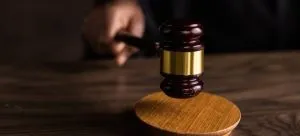 brown wooden gavel on brown wooden table