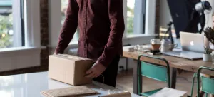 A man packing boxes, preparing to say goodbye to Hong Kong