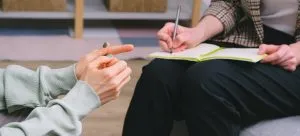 Two woman trying to choose a document storage company in HK.