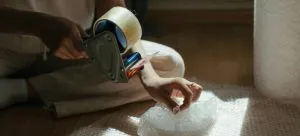 A woman packing something.