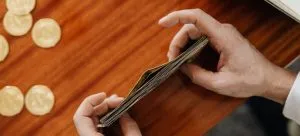 Man managing finances for boat shipping to another country .