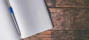 An open notebook is useful to create a plan, so you can organize an international relocation while pregnant.