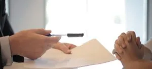 Signing contract.