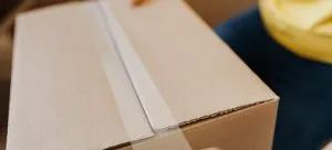 Man packing a box.