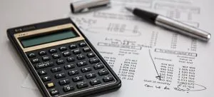 A calculator and a financial paper are useful to plan the budget, so you can hunt for a job before or after moving.