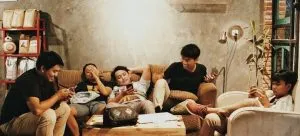 Friends sitting on a sofa.