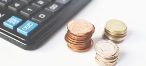 A calculator and coins. Use the calculator to define the budget before settling in Hong Kong.
