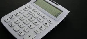 A calculator is useful to set the budget which is one of the tips for moving to Hong Kong for young couples.