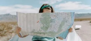 A girl holding a map.
