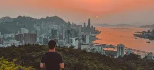 A hiker enjoying the view of Hong Kong.