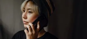 A woman talking on a phone.